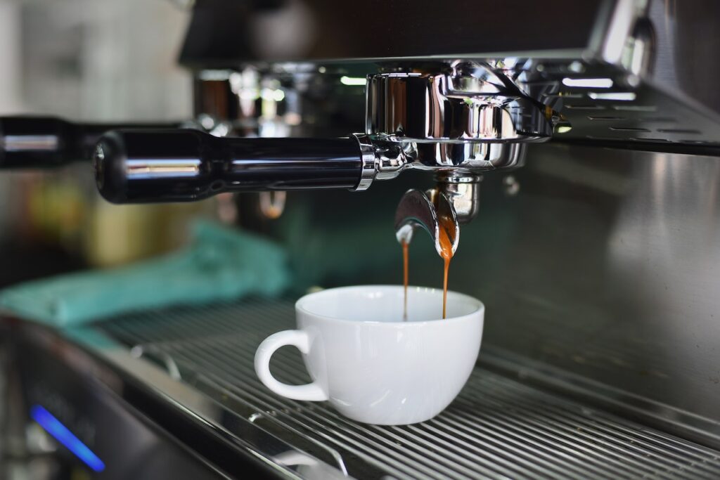 Coffee being poured from an espresso machine 