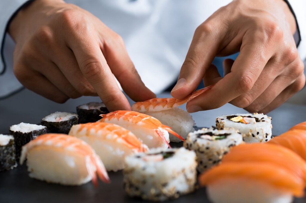 chef preparing sushi