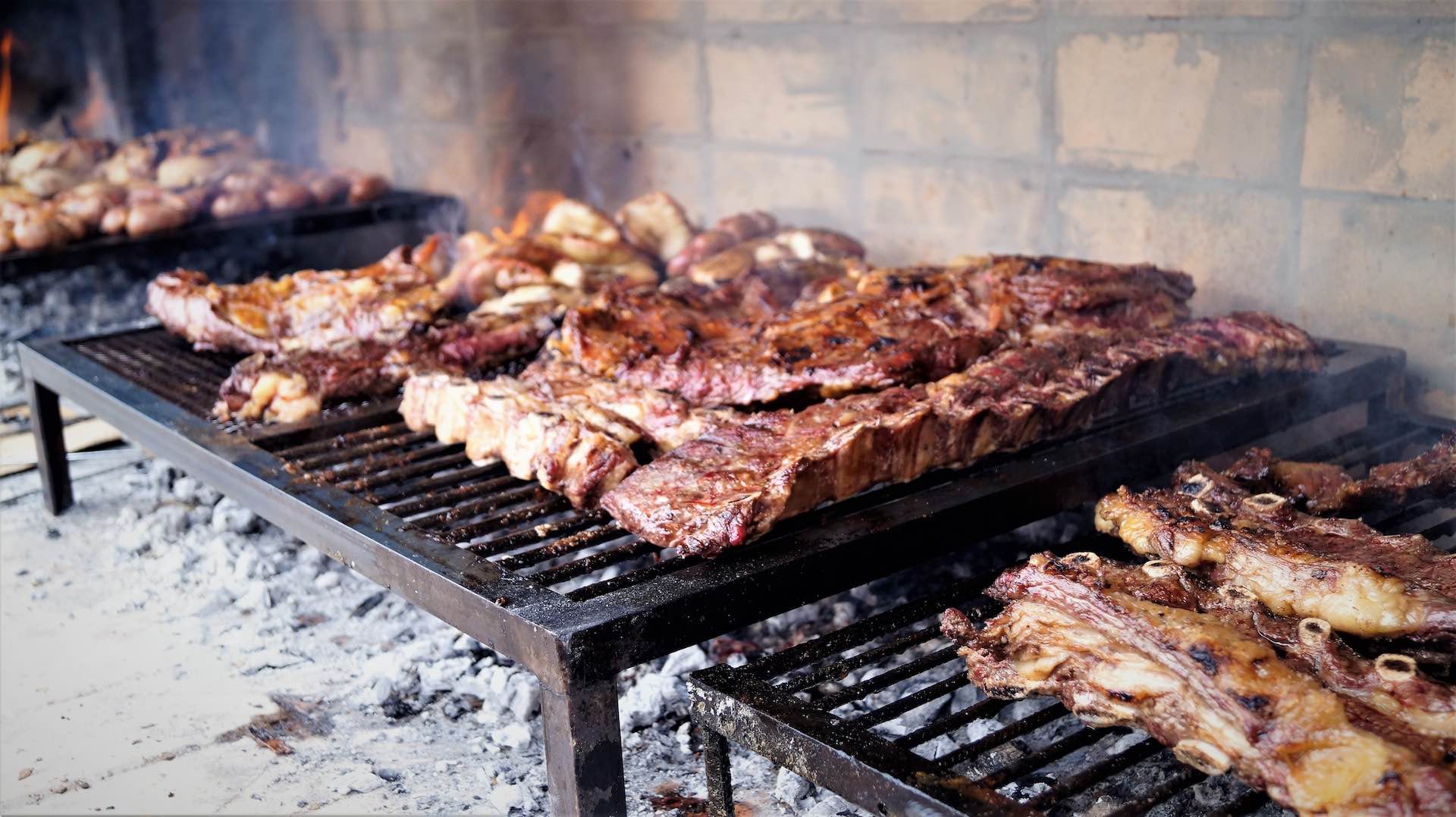 Asado - meat cooking on coal grille, Mendoza, Argentina