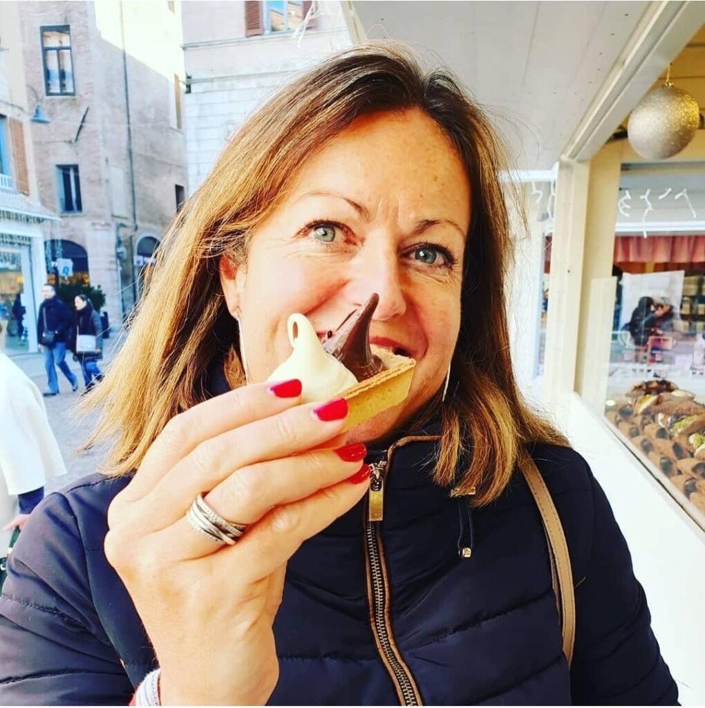 Trip planner Karen samples a delicate desert in Italy