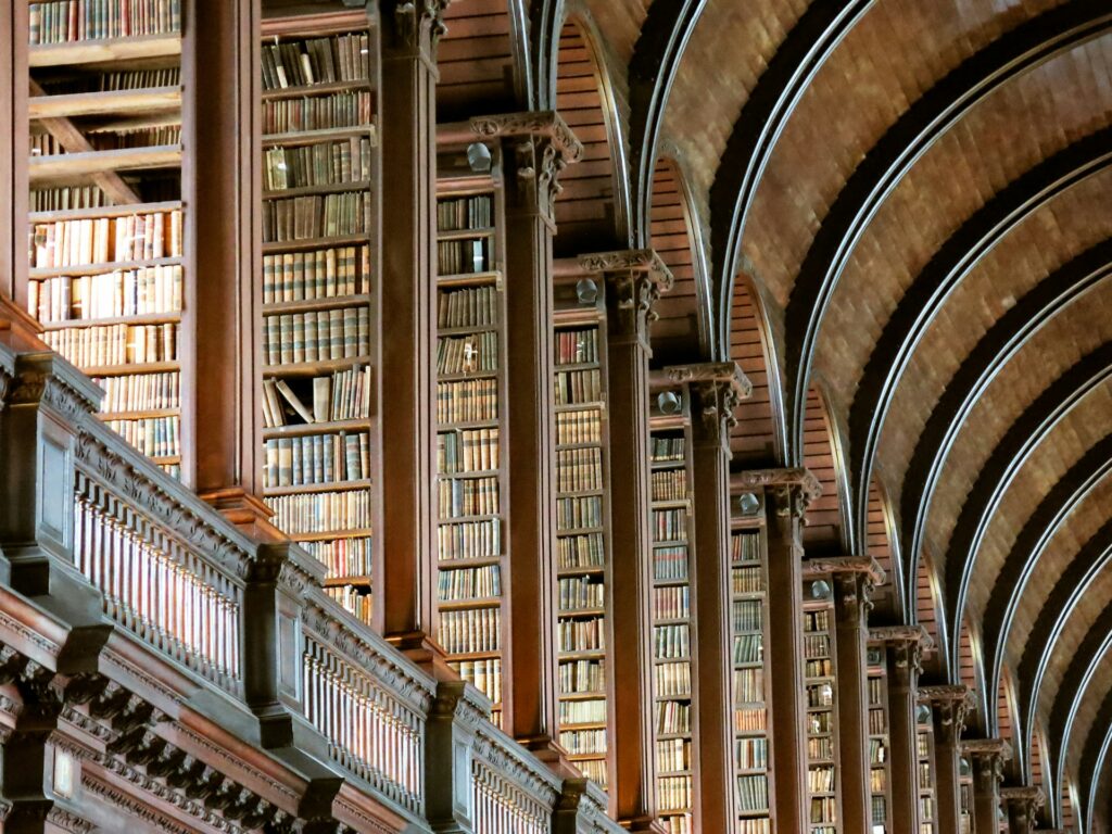 Close up view of books and vaulted ceiling in a library in Dublin