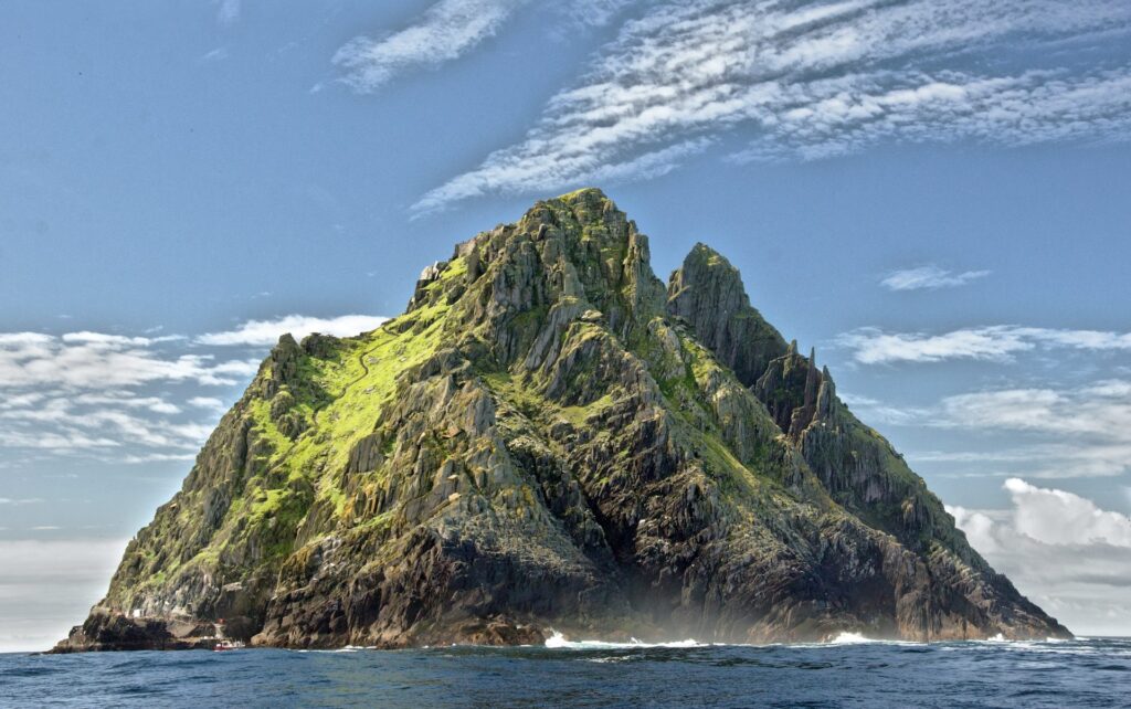 Tall rugged island shot from the water level 