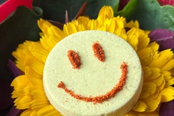 Plate of food resembling a smiley face