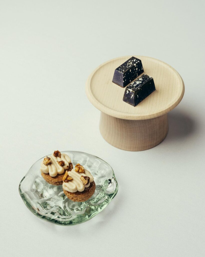 Delicate desserts on presentation plates