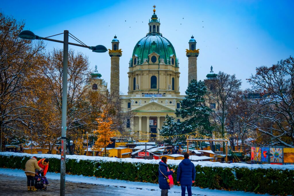 Large church with a market in the foreground, in winter with snow on the ground