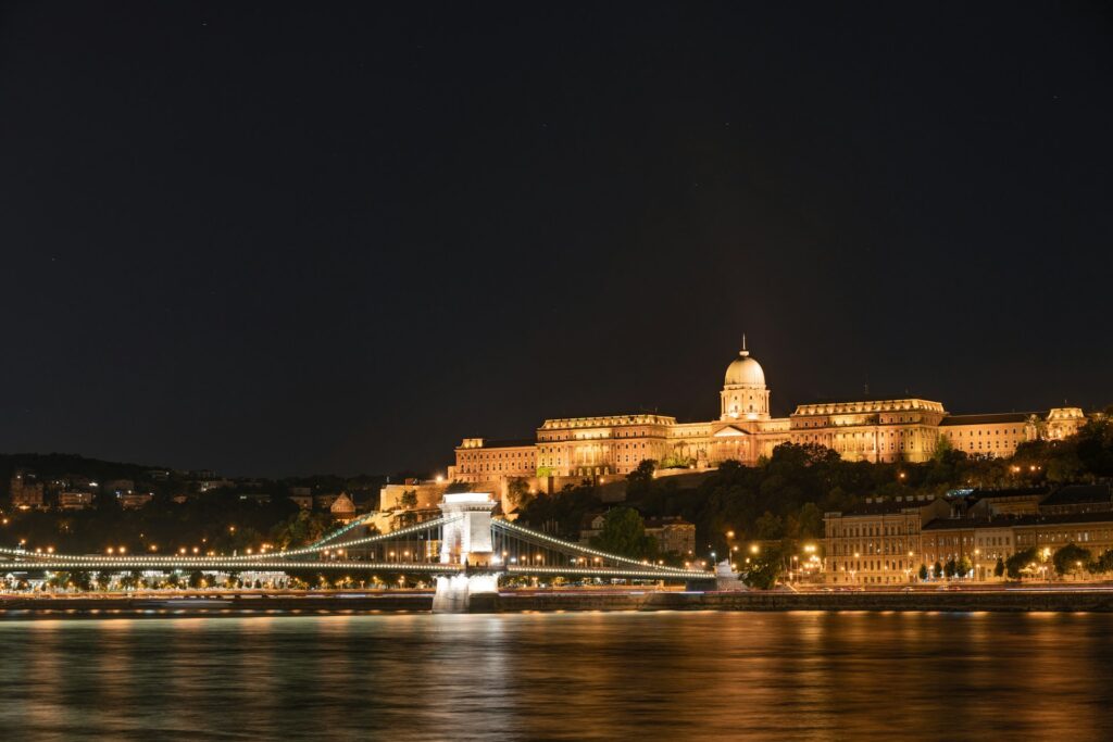 Budapest's Buda Castle, illuminated at night overlooking the Danube River