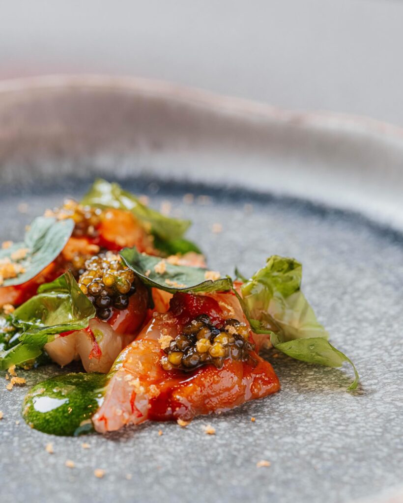 Plate of dressed seafood on a grey stoneware plate