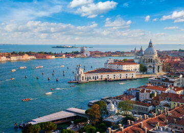 Buildings, landmarks, and ships on the coast of Venice, Italy