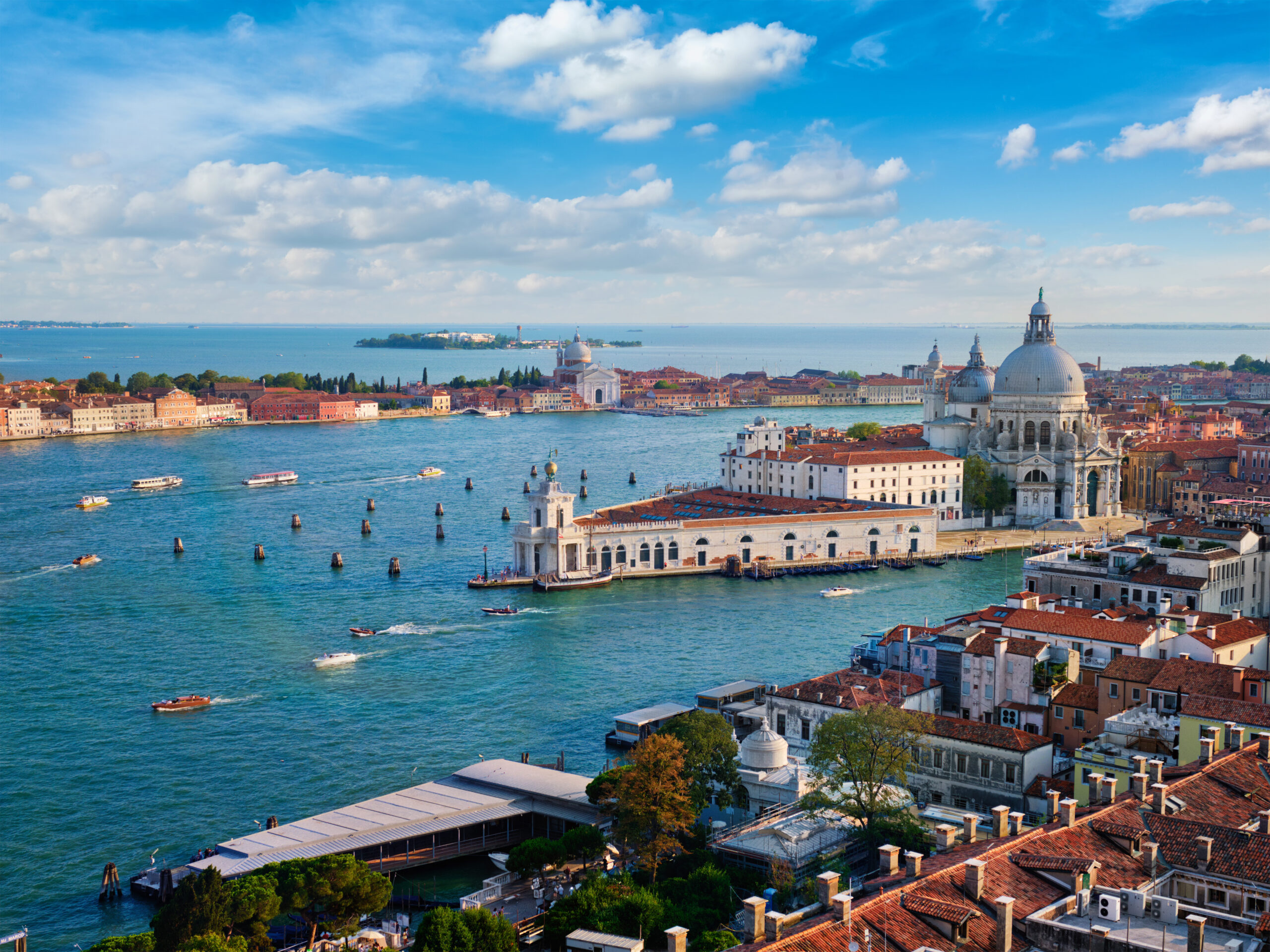 Buildings, landmarks, and ships on the coast of Venice, Italy