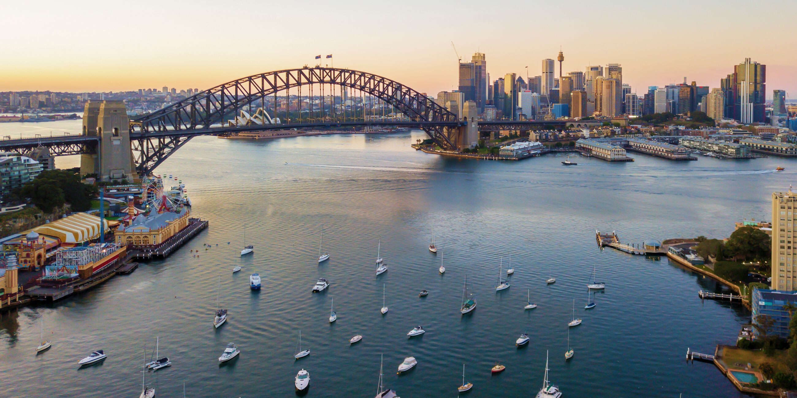 Boats in Sydney Harbour with the Sydney Opera House and Sydney Harbour Bridge in the background