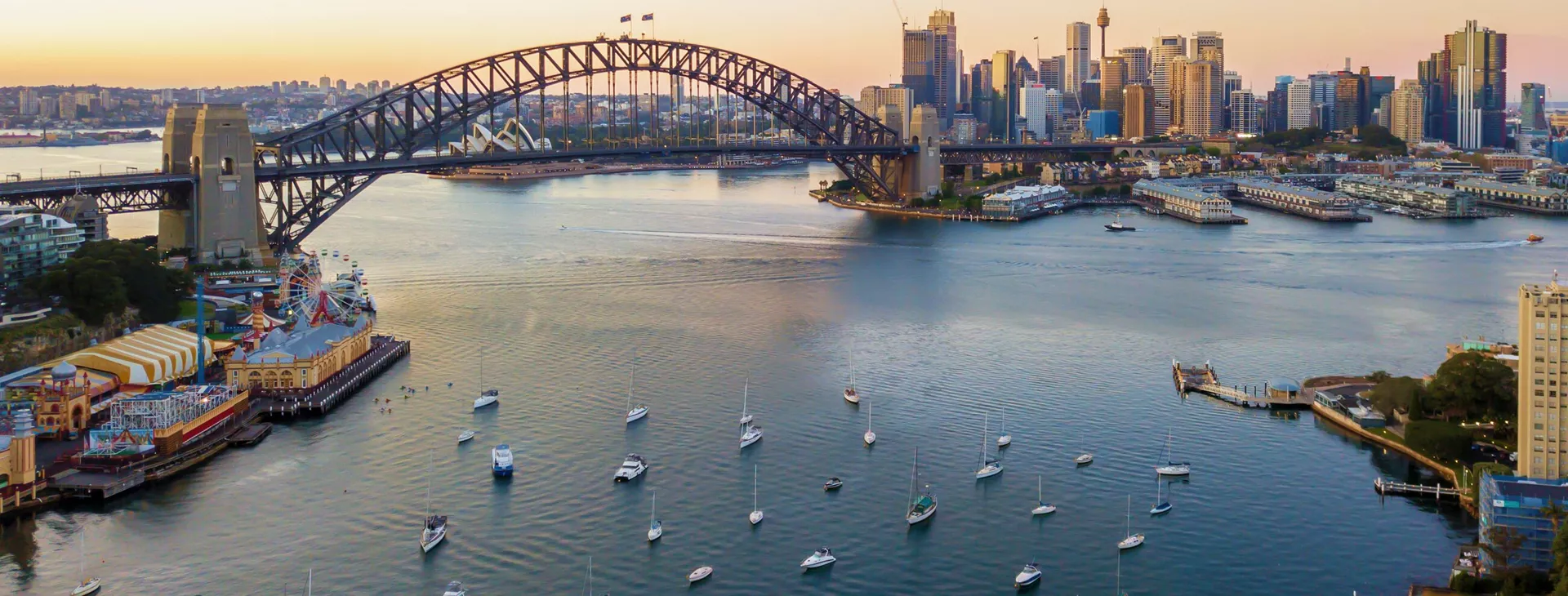 Boats in Sydney Harbour with the Sydney Opera House and Sydney Harbour Bridge in the background