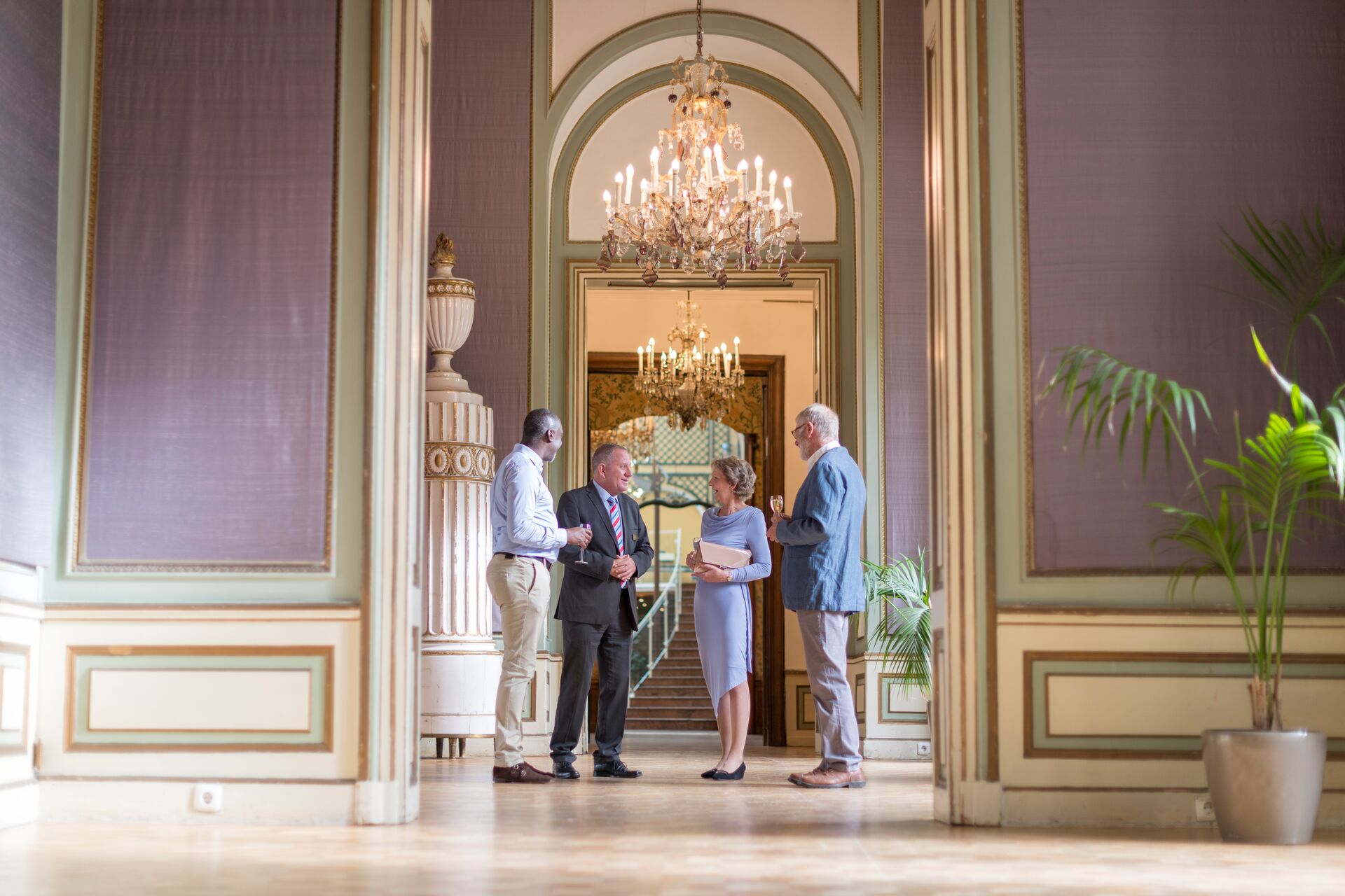 A group of people visiting a marvellous palace.