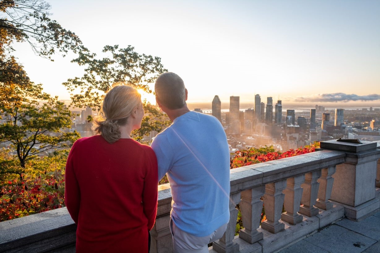 People On a Terrace Looking At City Skyline