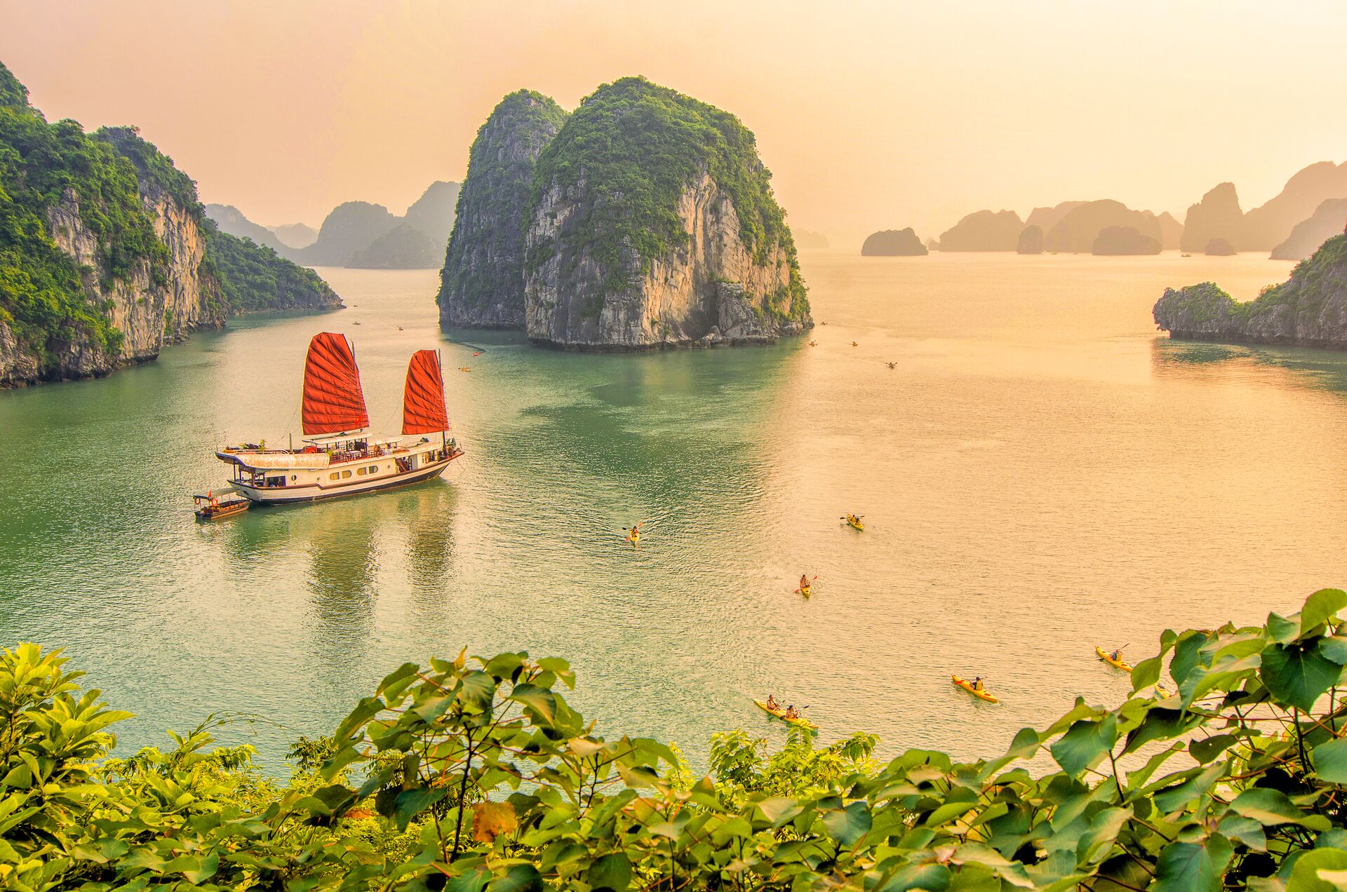 Traditional boat sailing during sunset in Ha Long Bay, Quang Ninh, Vietnam (Halong)
