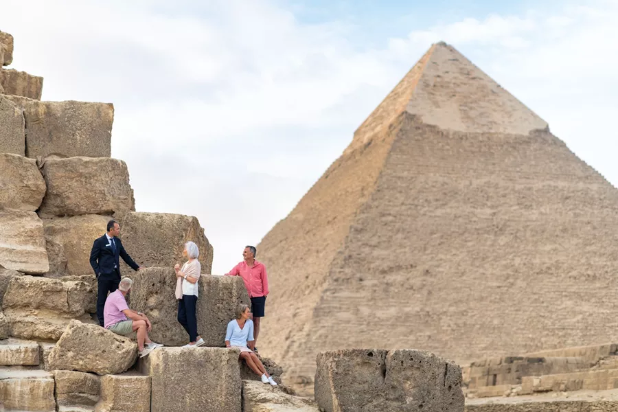Tourists chatting on the Great Pyramid of Giza in Egypt