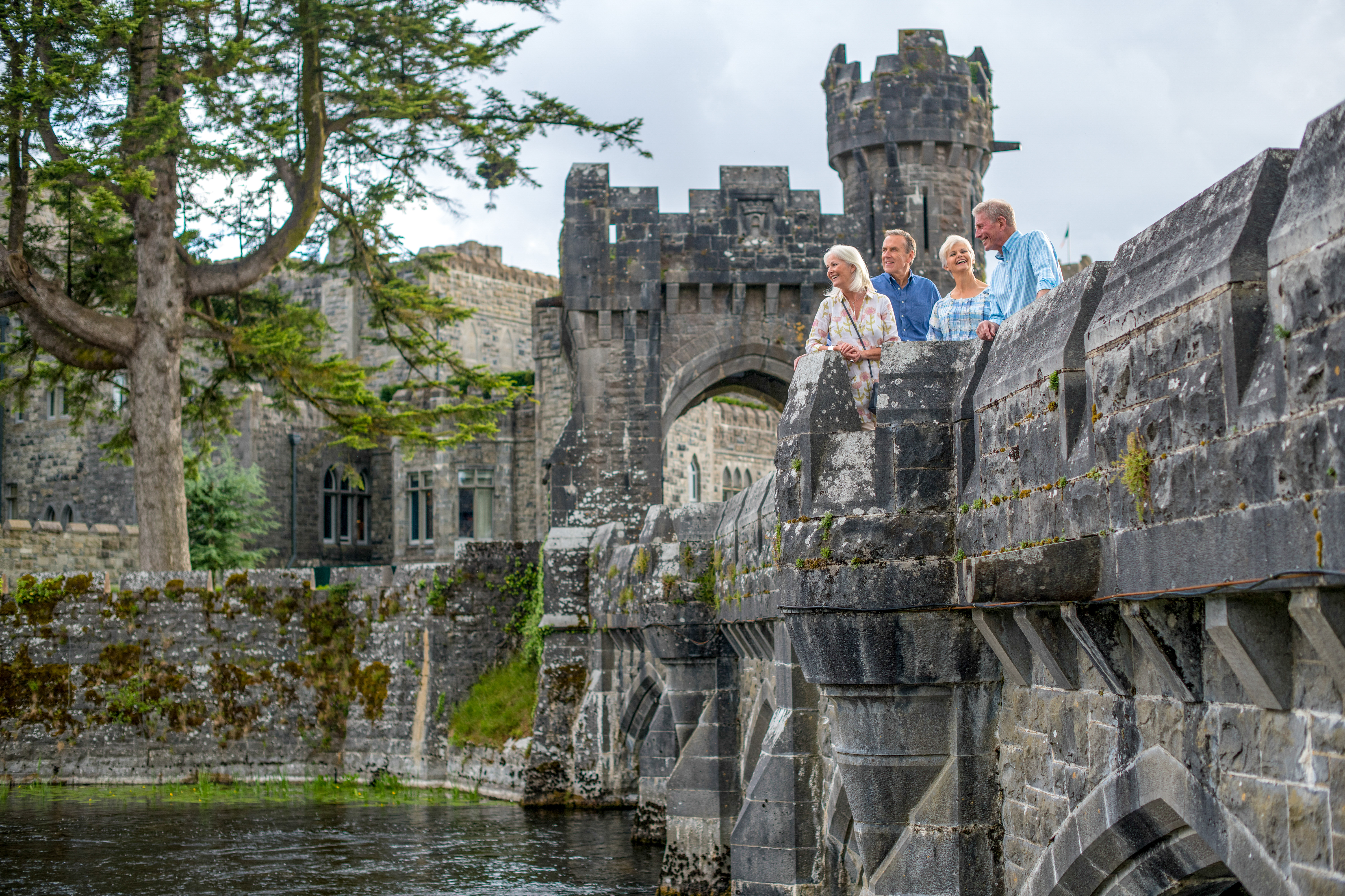 A group of people standing on a castle wall