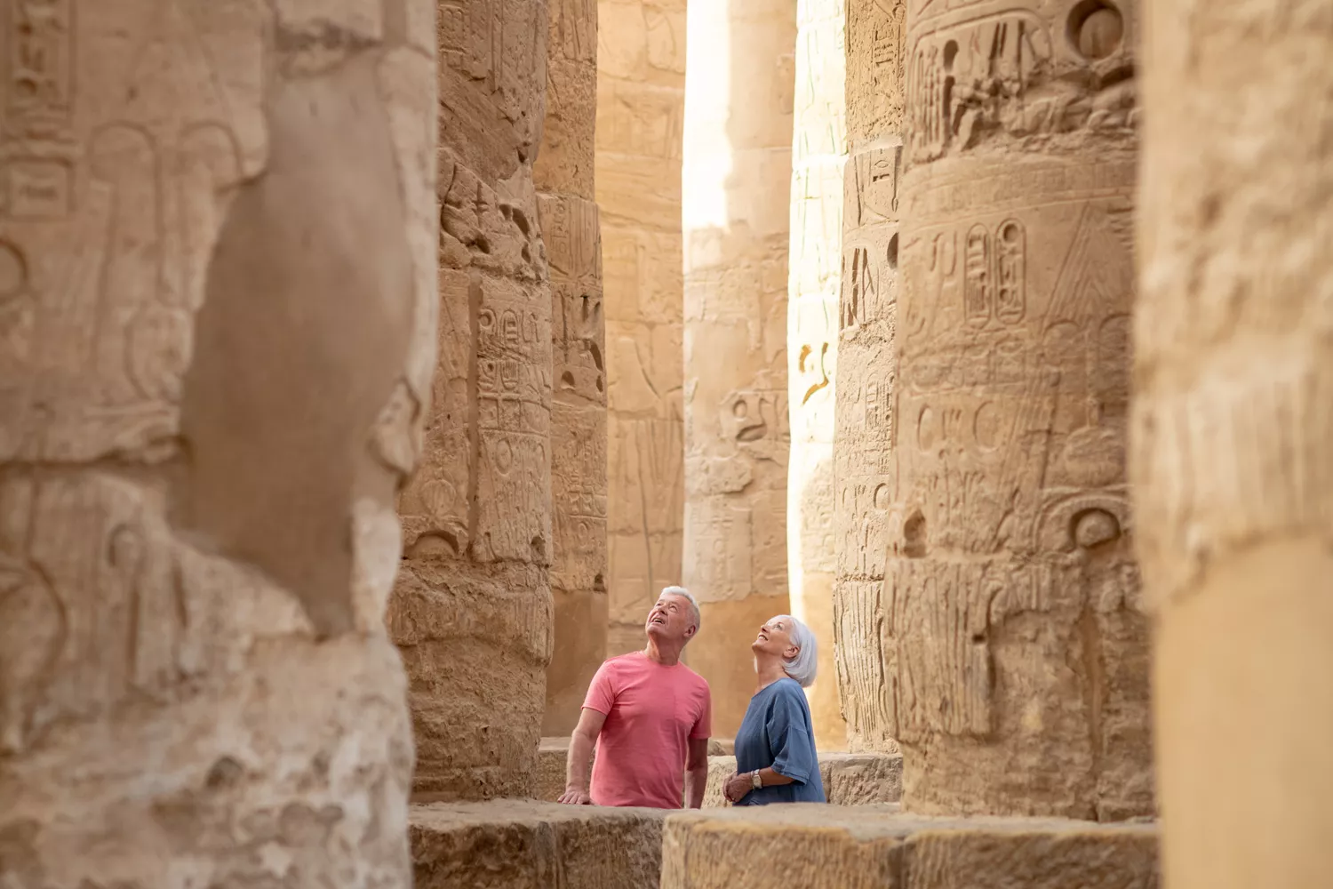 People visiting ancient Egyptian temple