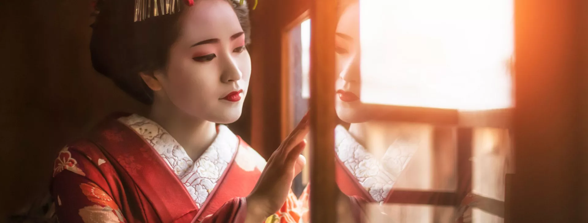 Geisha looking out of a window in Japan